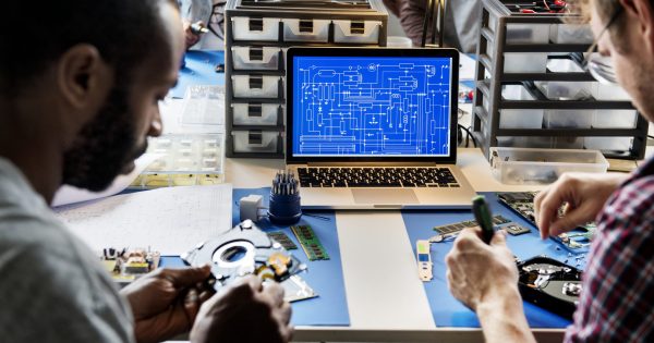 Computer laptop showing electronic circuit pattern